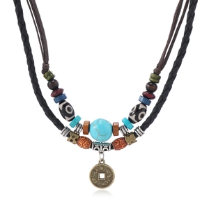 Bohemian layered turquoise bead necklace with vintage coin pendant on leather cord