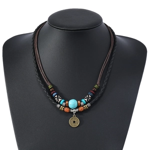 Bohemian multilayer turquoise beaded necklace with antique copper coin pendant on model