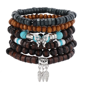 Detail of bohemian multilayer beaded bracelet set with turquoise and dreamcatcher charms