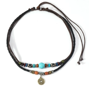 Vintage turquoise beaded necklace with ancient coin pendant on braided leather cords