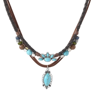 Close-up of bohemian double-layer necklace with turquoise pendant and wood beads