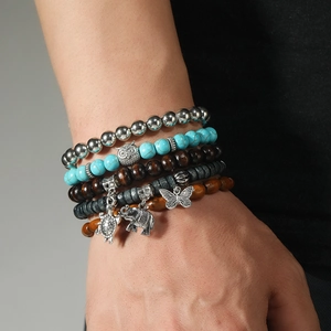 Bracelet multi-rangs bohème avec perles et breloques hibou, éléphant et tortue