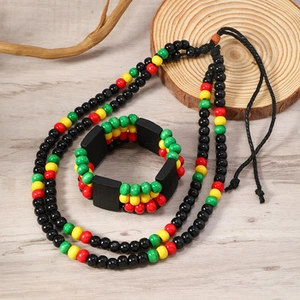 Detail of handmade ethnic wood bead necklace and bracelet set with reggae colors