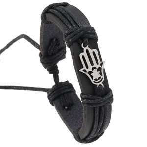 Detail of black woven leather bracelet featuring a silver Hamsa Hand pendant and pull cord