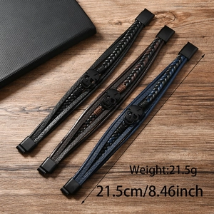 Three punk skull bracelets in black, brown, and navy leather with matte black clasp details