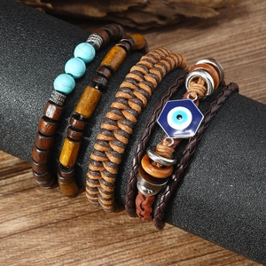 Detail view of multi-layer turquoise bead bracelets and braided leather cords on display