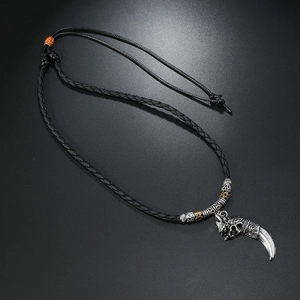 Detail of adjustable woven rope necklace with alloy wolf head and fang pendant