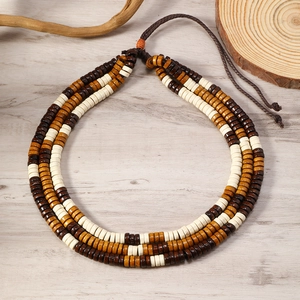 Detail view of multilayer vintage wooden bead necklace for beach and surf lifestyle