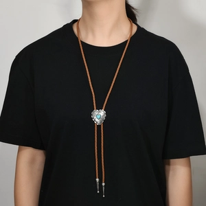 Western punk heart turquoise bolo tie with brown braided leather rope and metal tips
