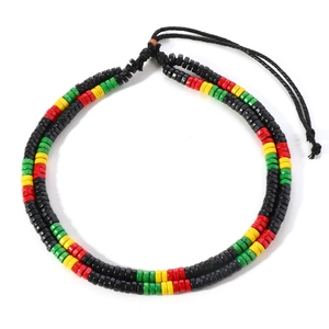 Close-up of Rasta color wooden beads on double-strand adjustable braided cord necklace