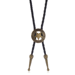 Macro view of vintage bronze star bolo tie pendant with intricate embossed textures