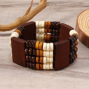 Detailed shot of ethnic wooden beaded bracelet with rustic polished square blocks