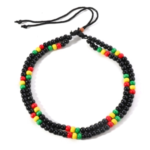 Detail of handmade double-layer wooden bead necklace in red, yellow, green and black colors