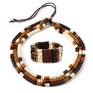 Detailed macro view of handmade boho wooden bead necklace and multi-layer bracelet set