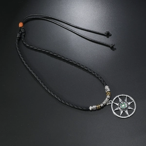 Detail of compass pendant with adjustable black braided cord and vintage alloy beads