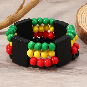 Detail of Rasta style multilayer wooden bead bracelet with red, yellow, and green accents