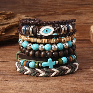 Bracelet bohème multicouche avec œil protecteur, croix turquoise et cordons en cuir