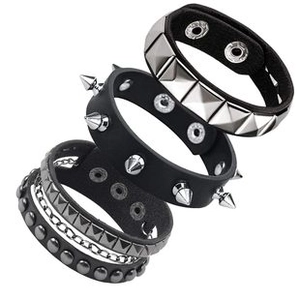 Detail of three black leather punk bracelets with silver studs and metal chains