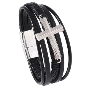 Detailed view of multilayer leather bracelet with a silver cross and magnetic clasp