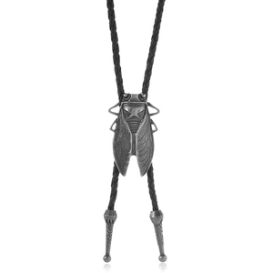 Detail of vintage bolo tie showing cicada pendant with antique silver finish and woven cord