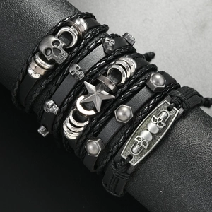 Five-piece punk leather bracelet set featuring silver skulls, stars, and metal studs