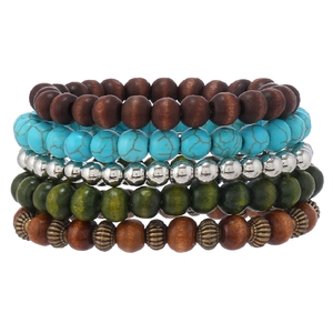 Macro detail of bohemian five-piece beaded bracelet set with turquoise and wood beads