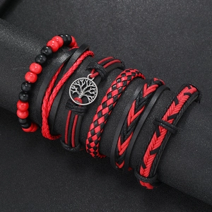 Detail view of multi-layer leather bracelet with Tree of Life charm on display
