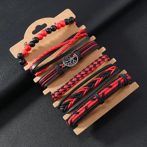Macro shot of 6-piece red and black multilayer braided leather tree of life bracelets