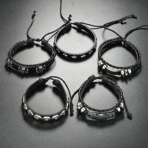 Men's punk leather bracelet set with skull charms and metallic studs on black bands