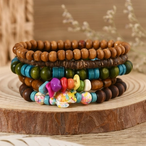 Multilayer turquoise beaded bracelet set with turtle charm on natural wood base
