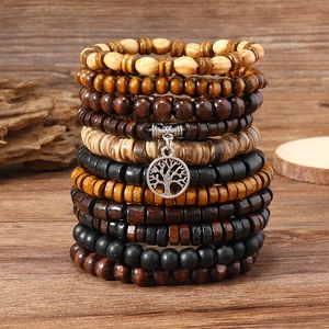 Retro multi-layered wooden bead bracelet set with silver tree of life charm detail