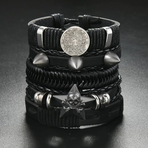 Detail of multi-layer leather bracelet with punk rivets, cross, and skull metal charms