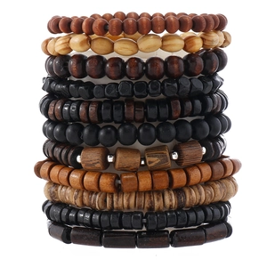 Detailed stack of multi-layered wooden beaded bracelets with mixed textures and natural wood tones