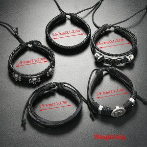 Detail of 5-piece punk bracelet set featuring skull charms and woven faux leather