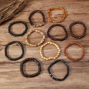 Detailed flat lay of diverse wooden bead bracelets in natural, coffee, and reddish tones