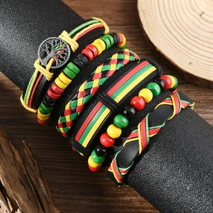Close-up of Rasta style multilayer leather bracelets with Tree of Life metal charm