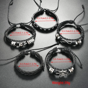 Detail of five-piece multilayer braided leather bracelets with nautical charms and size labels