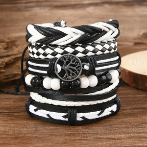 Detail of multi-layer Tree of Life leather bracelets with beads and woven textures