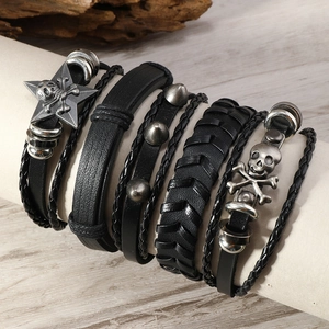 Men's punk multi-layer leather bracelet set with skull and star charms on display
