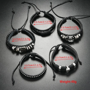 Detail of 5-piece black leather bracelet set featuring gothic skull and star charms