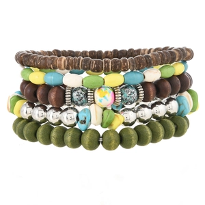 Detail of bohemian multilayer beaded bracelet set with turquoise and wooden beads