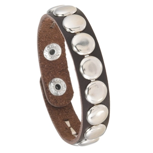 Detail of dark brown leather punk bracelet with round silver rivets and adjustable snaps