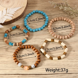 Detail view of 5-piece multilayer turquoise bead bracelet set with 5.7cm diameter