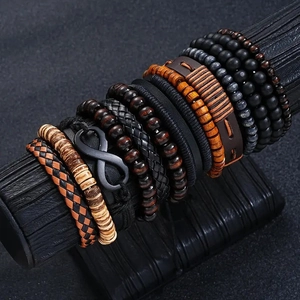 Close-up of men's leather bracelets with coconut shell beads and infinity metal charm
