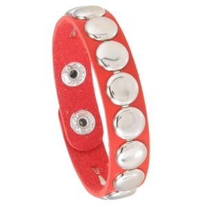 Macro shot of red leather punk bracelet with silver metal studs and snap button closure