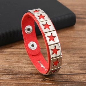 Detail of red leather star bracelet with silver studs and adjustable metal snap buttons