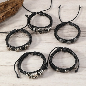 Five-piece set of black leather punk skull bracelets with vintage silver metal charms