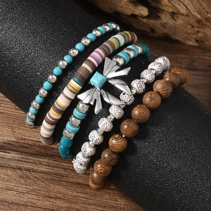 Five-piece bohemian bracelet set with turquoise beads, wood, and silver metal accents