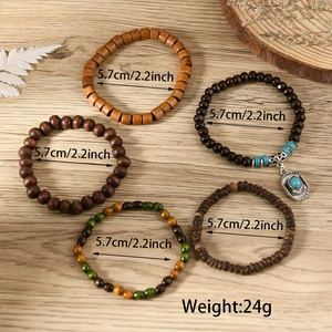 Detailed view of a five-piece set of wooden and turquoise beads bracelets with 5.7cm diameter