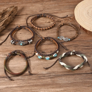 6-piece bohemian leather bracelet set with turquoise beads on rustic wood background